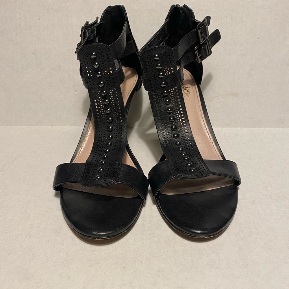 Coach and Four black heels with gunmetal studs.